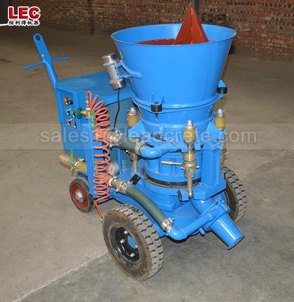 Dry spraying refractory gunite machine applied