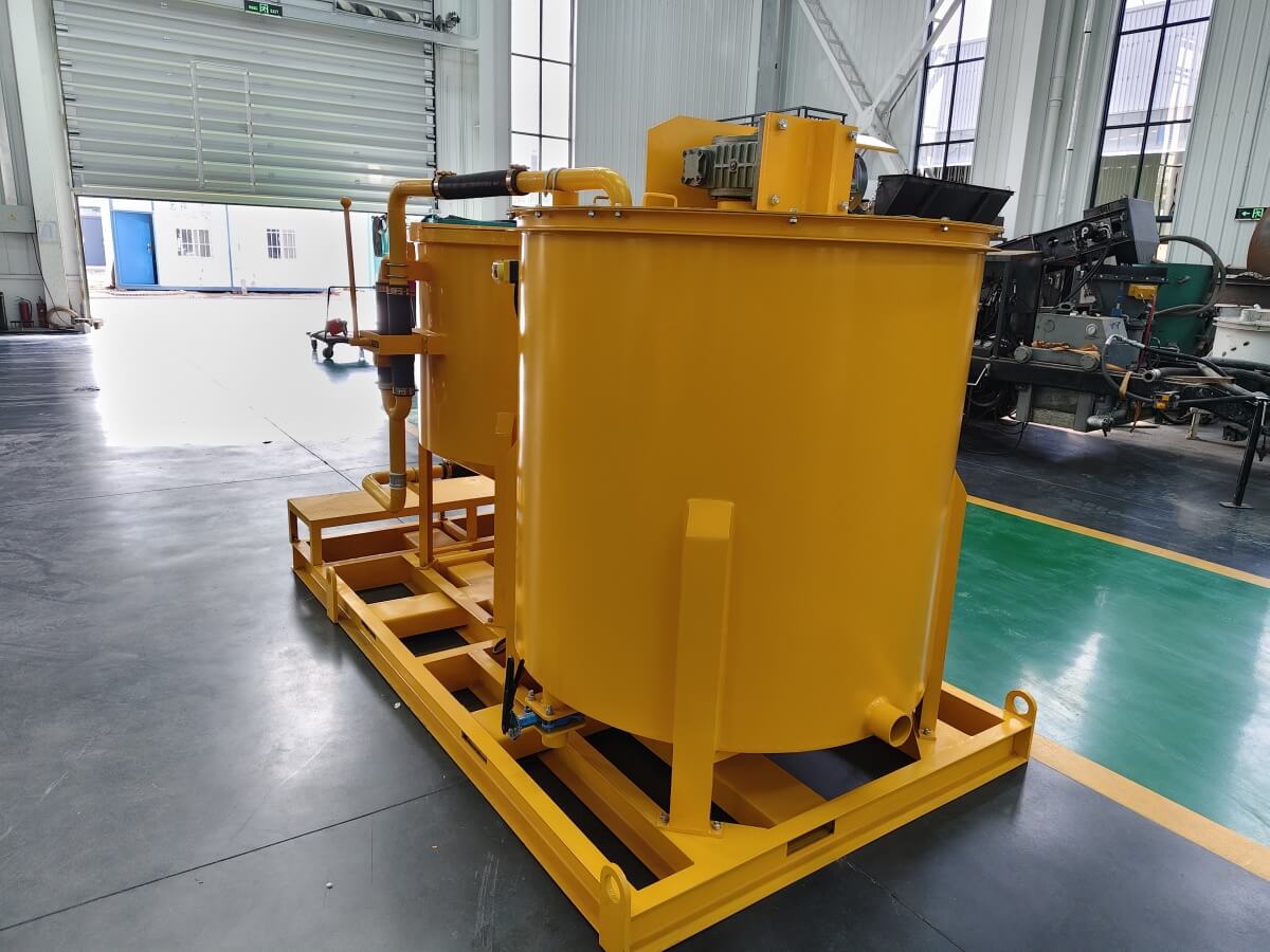 Water and cement grout mixer with agitator
