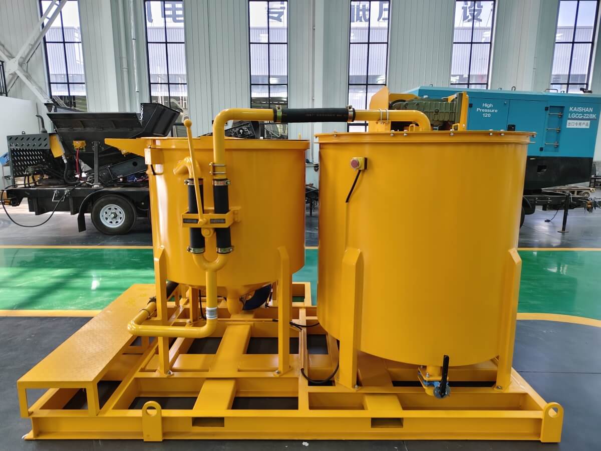 Water and cement grout mixer with agitator